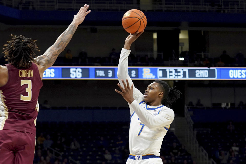 Pittsburgh's Carlton Carrington (7) shoots against Florida State's Cam Corhen (3) during the second half of an NCAA college basketball game Tuesday, March 5, 2024, in Pittsburgh. (AP Photo/Matt Freed)