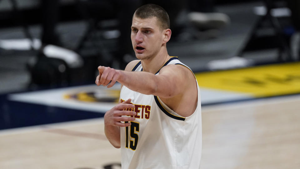 Nikola Jokic points during a game.