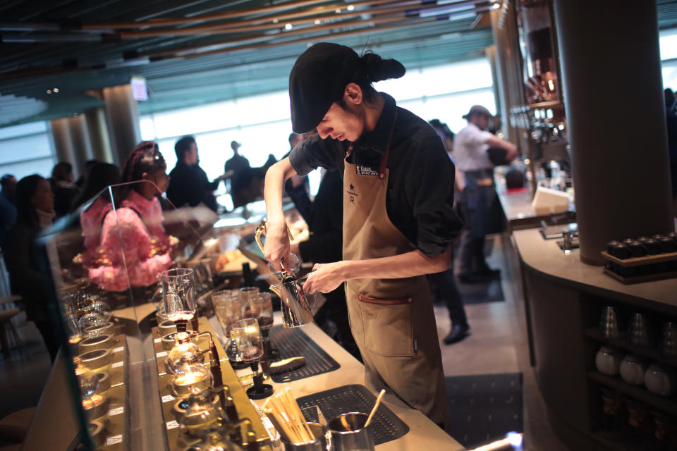 CHICAGO, ILLINOIS - NOVEMBER 12: A worker prepares drinks during a media preview at Starbucks Reserve Roastery on November 12, 2019 in Chicago, Illinois. With 35,000 square feet over four floors and a rooftop deck, the restaurant, which opens to the public on November 15, will be the company's largest. The restaurant features a cocktail bar, a reserve coffee bar, and experimental coffee bar and a bakery and cafe, each on separate levels.  (Photo by Scott Olson/Getty Images)