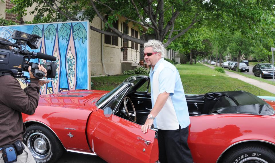 Guy Fieri with his trademark red Camaro in 2009 when he visited Rhode Island restaurants.