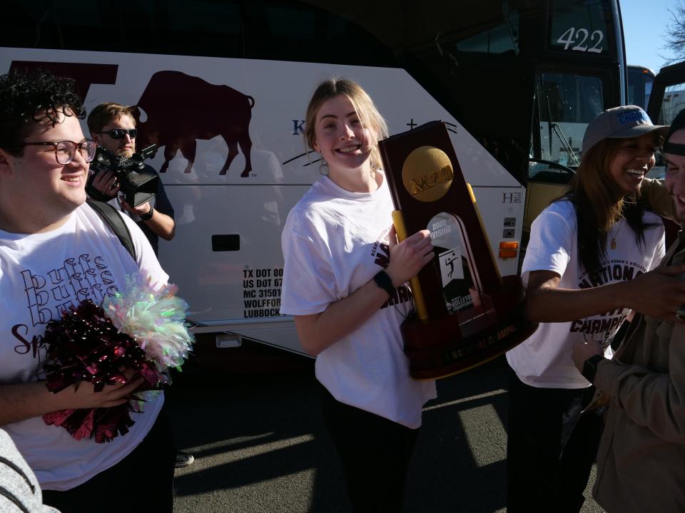 WT's Katrina Johnson poses with the National Championship trophy after the Lady Buffs returned to campus on Monday, Dec. 5, 2022.