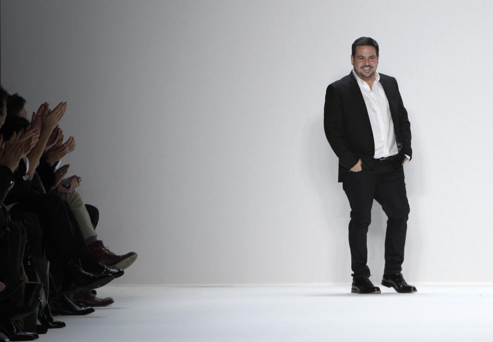 FILE - In this Feb. 14, 2012 file photo, designer Narciso Rodriguez appears on the runway at the end of the presentation of the his Fall 2012 collection during Fashion Week in New York. El Museo del Barrio will honor the designer of Cuban descent next month during its annual gala. In its announcement, El Museo said that Rodriguez is considered one of the 25 most influential Hispanics in America. (AP Photo/Kathy Willens, file)