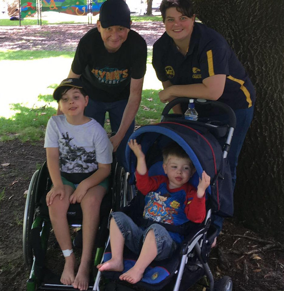 Photo of Perth parents Luke and Amy with their children Logan (left) and Flynn (right). 