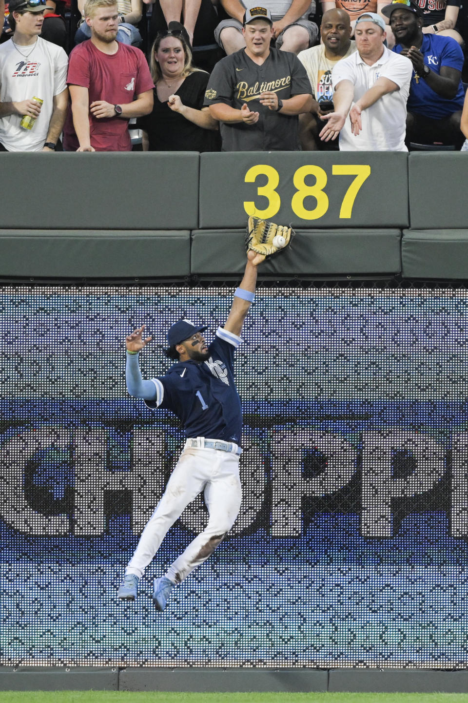 Kansas City Royals left fielder MJ Melendez cannot make the catch on a two-run double by Boston Red Sox's J.D. Martinez during the fourth inning of a baseball game Friday, Aug. 5, 2022, in Kansas City, Mo. (AP Photo/Reed Hoffmann)