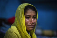 Sonali Begum, 17, cries as she describes how her husband Siddique Ali, 23, was picked up by the police, at her rented house in Guwahati, India, Saturday, Feb. 4, 2023. Indian police have arrested more than 2,000 men in a crackdown on illegal child marriages in involving girls under the age of 18 a northeastern state. Begum is seven months pregnant. (AP Photo/Anupam Nath)