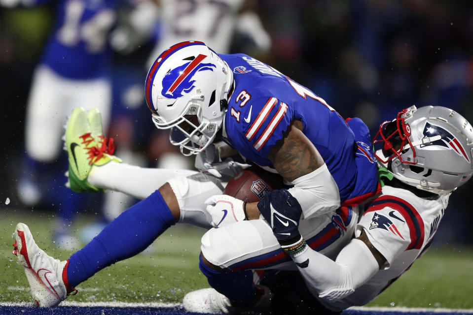 Buffalo Bills wide receiver Gabriel Davis (13) falls into the end zone for a touchdown with New England Patriots cornerback Jalen Mills (2) defending during the first half of an NFL football game in Orchard Park, N.Y., Monday, Dec. 6, 2021. (AP Photo/Joshua Bessex)