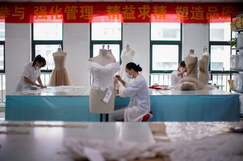 The Wider Image: Coronavirus dampens celebrations in China's wedding gown city