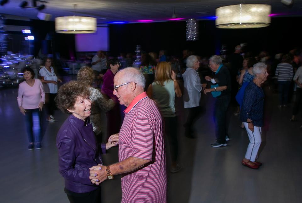 Kings Points residents Arnie Steinberg, left, and her husband, Roz, dance to a cover of "My Girl," during a dance party celebrating the 50th anniversary of Kings Point on Thursday. "This is one of my favorites," Roz Steinberg said.