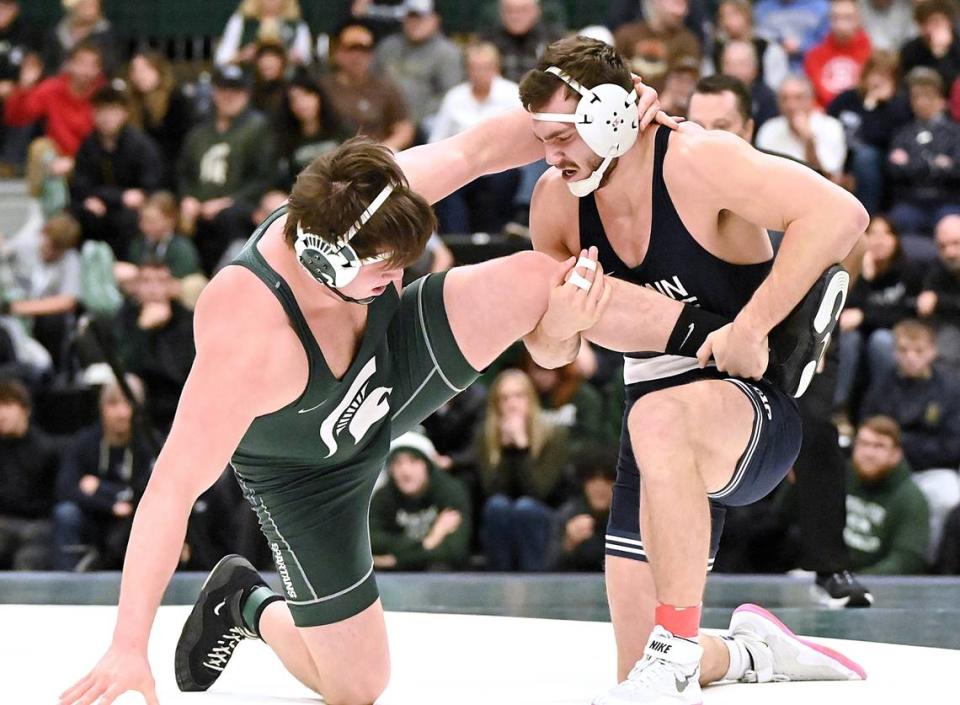 Penn State’s Lucas Cochran looks to finish off a takedown of Michigan State’s Josh Terrill in their 285-pound bout of the Nittany Lions’ 35-0 win on Sunday at East Lansing, Mich. Cochran, who filled in for Greg Kerkvliet, shut out Terrill, 5-0.
