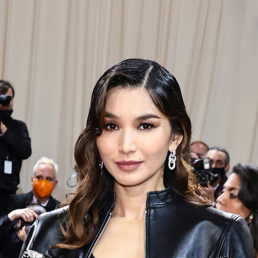 Gemma Chan wearing long lashes and matching eye and lip makeup