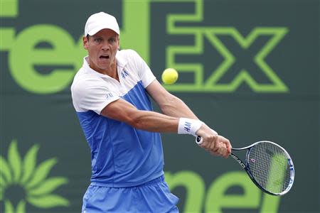 Mar 27, 2014; Miami, FL, USA; Tomas Berdych hits a backhand against Alexandr Dolgopolov (not pictured) on day eleven of the Sony Open at Crandon Tennis Center. BGeoff Burke-USA TODAY Sports