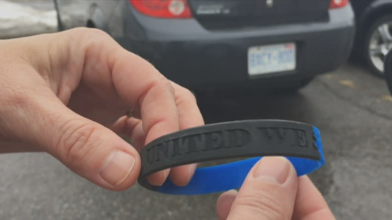 Community and Police Action Committee faces barrage of criticism over wristbands