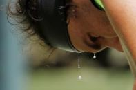 Mar 31, 2017; Miami, FL, USA; sweat drips from the face of Rafael Nadal of Spain against Fabio Fognini of Italy (not pictured) during a men's singles semi-final in the 2017 Miami Open at Brandon Park Tennis Center. Nadal won 6-1, 7-5. Geoff Burke-USA TODAY Sports