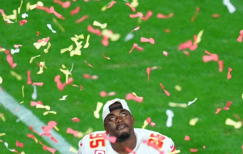 Kansas City Chiefs defensive tackle Chris Jones (95) looks up at the confetti after defeating the Philadelphia Eagles in Super Bowl LVII at State Farm Stadium in Glendale