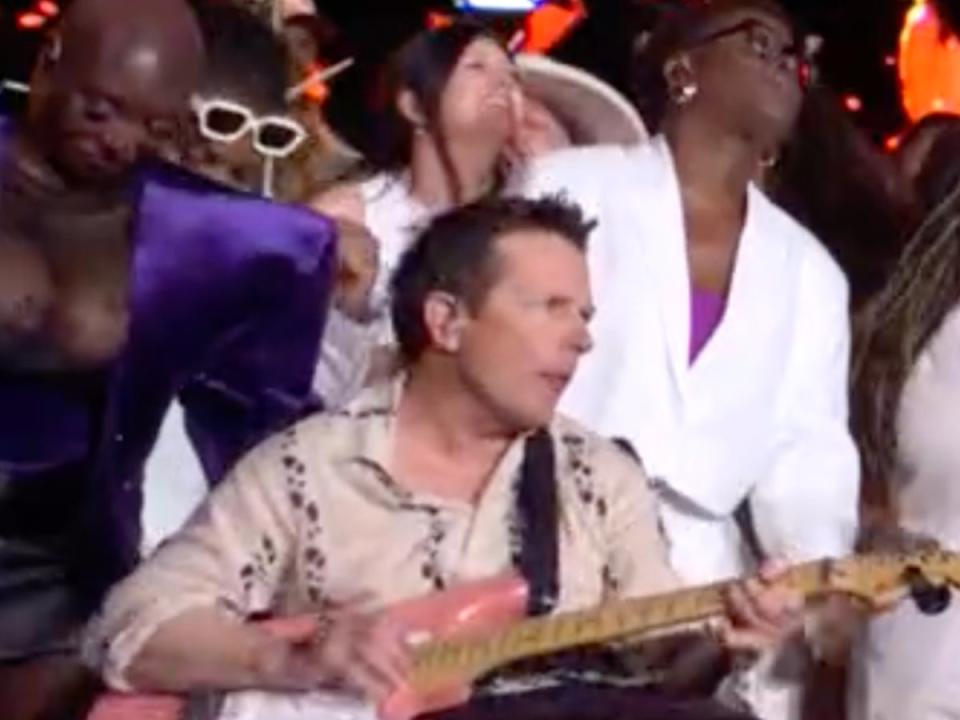 Michael J Fox was brought on stage by Coldplay at Glastonbury 2024 (BBC)