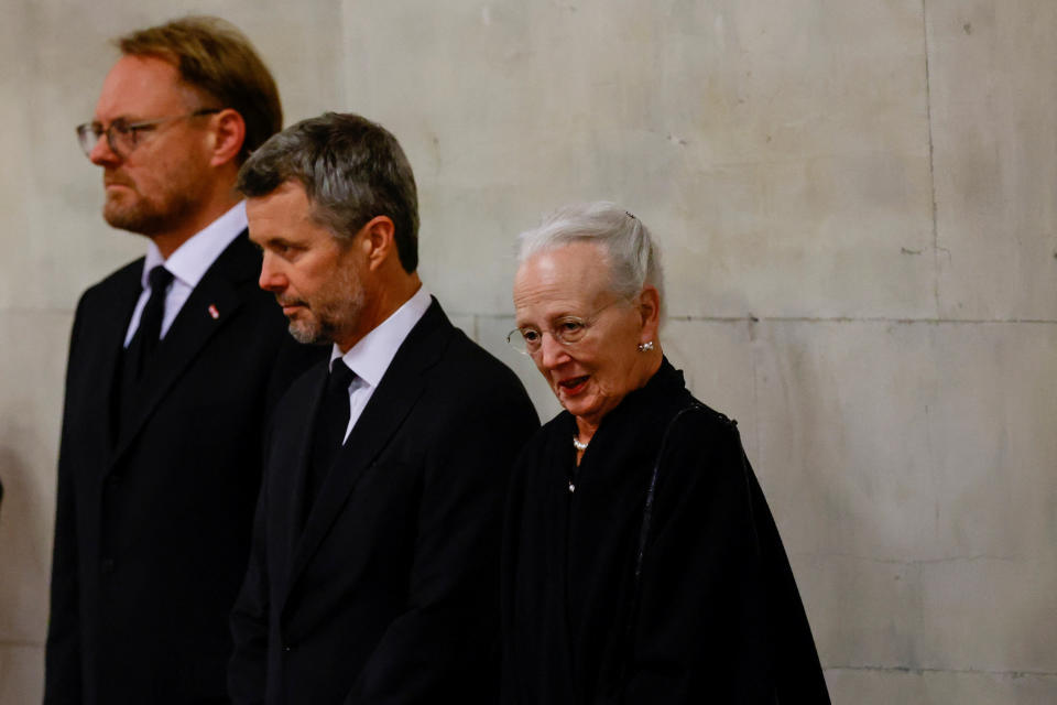 Denmark's Queen Margrethe and Crown Prince Frederik view the coffin of Queen Elizabeth II, lying in state on the catafalque in Westminster Hall, at the Palace of Westminster, London. Picture date: Sunday September 18, 2022.