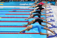 Competitors dive in at the start of the Women's 4x100m Freestyle Relay final on Day 1 of the London 2012 Olympic Games at the Aquatics Centre on July 28, 2012 in London, England. (Photo by Cameron Spencer/Getty Images)