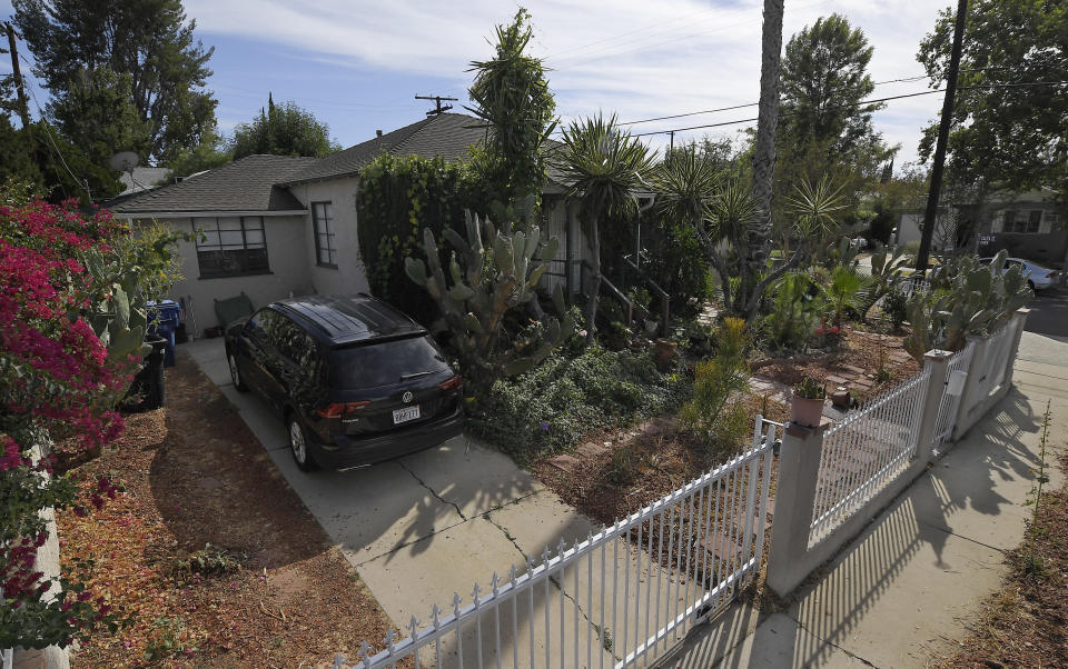 This photo shows the driveway of Robert Chain's house in the Encino section of Los Angeles, Thursday, Aug. 30, 2018. Chain, who was upset about The Boston Globe's coordinated editorial response to President Donald Trump's attacks on the news media, was arrested Thursday for threatening to travel to the newspaper's offices and kill journalists, whom he called the "enemy of the people," federal prosecutors said. (AP Photo/Mark J. Terrill)