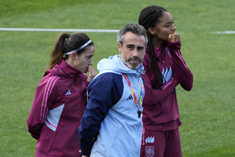 Spain's head coach Jorge Vilda, center, arrives with players for a team training session in Sydney Friday, Aug. 18, 2023, ahead of the Women's World Cup final against England on Sunday. (AP Photo/Rick Rycroft)