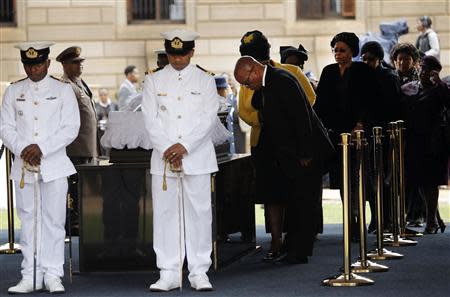 South African President Jacob Zuma pays his respects at the coffin of former South African President Nelson Mandela, as Mandela lies in state at the Union Buildings in Pretoria December 11, 2013. REUTERS/Kim Ludbrook/Pool