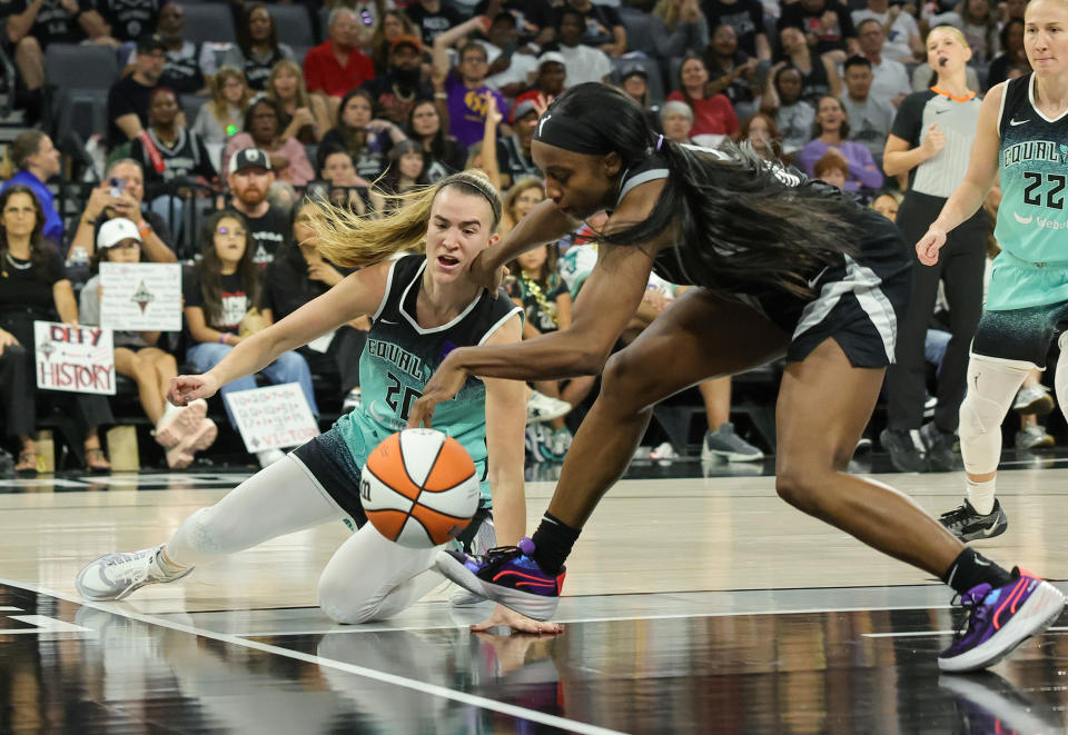 LAS VEGAS, NEVADA - OCTOBER 04: Sabrina Ionescu #20 of the New York Liberty and Jackie Young #0 of the Las Vegas Aces vie for a loose ball in the second quarter of Game Three of the 2024 WNBA Playoffs semifinals at Michelob ULTRA Arena on October 04, 2024 in Las Vegas, Nevada. NOTE TO USER: User expressly acknowledges and agrees that, by downloading and or using this photograph, User is consenting to the terms and conditions of the Getty Images License Agreement. (Photo by Ethan Miller/Getty Images)