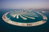 "He plans to develop a park on 600 acres on the lines of the New York park which is spread over 800 acres," officials said. (Pictured left: An aerial view of the man-made Palm Jumeirah islands in Dubai, UAE)