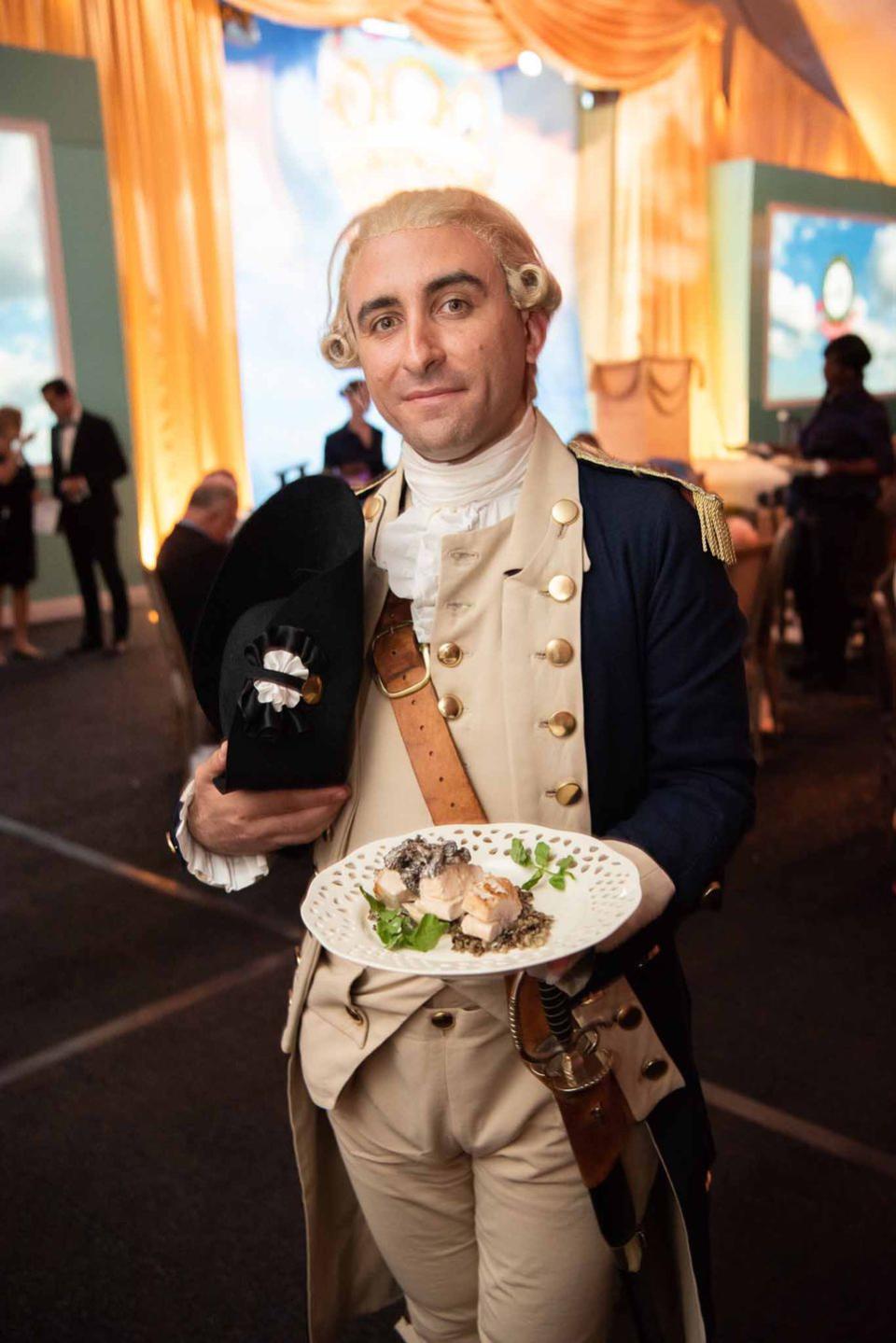 The Marquis de Lafayette stands with his favorite dish: Poulet à la crème with morels and wild rice pilaf.