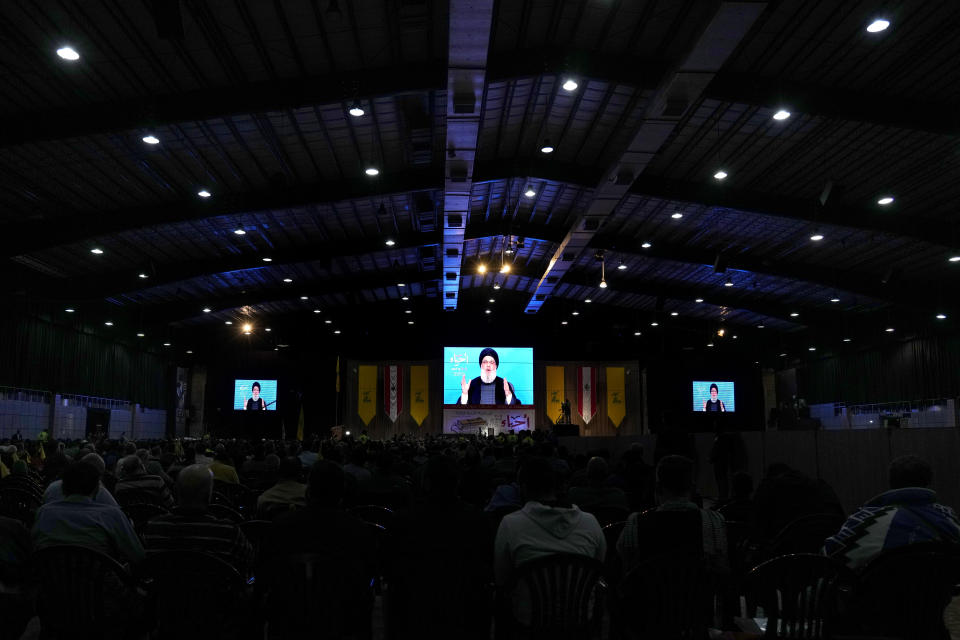 Hezbollah leader Sayyed Hassan Nasrallah speaks via a video link during a rally marking Hezbollah Martyr's Day, in the southern Beirut suburb of Dahiyeh, Lebanon, Friday, Nov. 11, 2022. Nasrallah said his group wants a new Lebanese president that will not "betray" the Iran-backed faction in the future adding that the United States is doing all it can strangle the group. (AP Photo/Bilal Hussein)