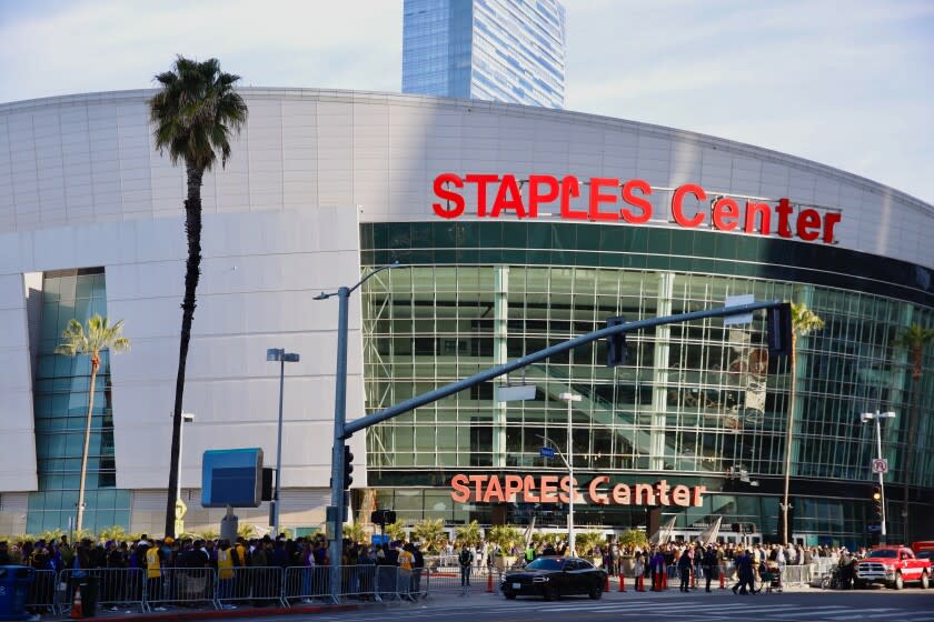 LOS ANGELES CA FEBRUARY 24, 2020 -- Fans gather outside Staples Center the the 'Celebration of Life' for Kobe and Gianna Bryant, honoring the late NBA legend and his 13-year-old daughter who died along with seven others in a helicopter crash in Calabasas last month. (Jay L. Clendenin / Los Angeles Times)