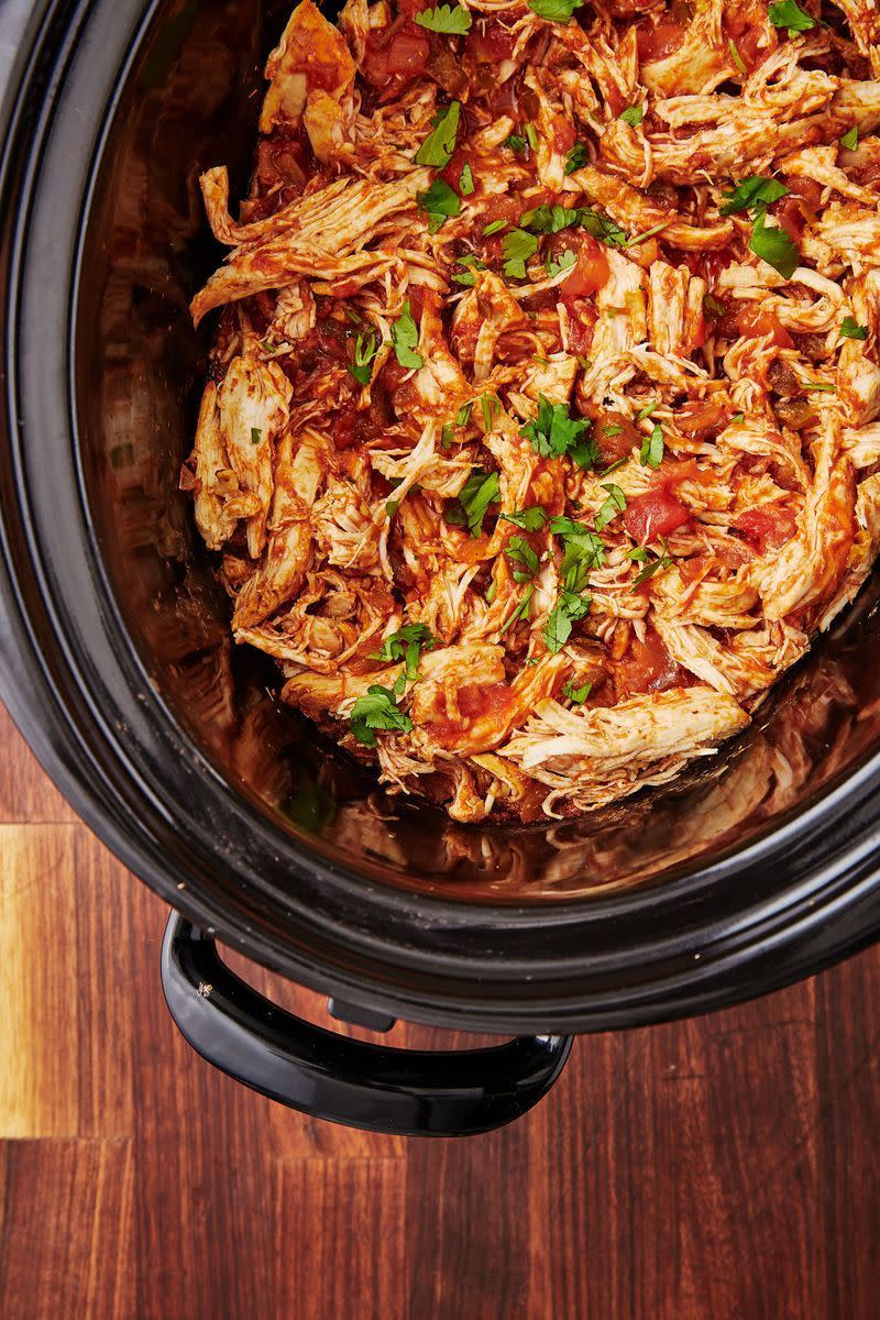 <p>This is probably THE simplest recipe, ever? A <a href="https://www.delish.com/uk/cooking/recipes/g30220431/slow-cooker-recipes/" rel="nofollow noopener" target="_blank" data-ylk="slk:slow cooker meal" class="link rapid-noclick-resp">slow cooker meal</a> made with only 4 ingredients is really something to celebrate. The chicken falls apart and becomes immensely tender, flavoured with the familiar flavours of chunky salsa and taco seasoning, and brightened up with bursts of lime juice. </p><p>Get the <a href="https://www.delish.com/uk/cooking/recipes/a30725169/crockpot-salsa-chicken-recipe/" rel="nofollow noopener" target="_blank" data-ylk="slk:Slow Cooker Salsa Chicken" class="link rapid-noclick-resp">Slow Cooker Salsa Chicken</a> recipe.</p>