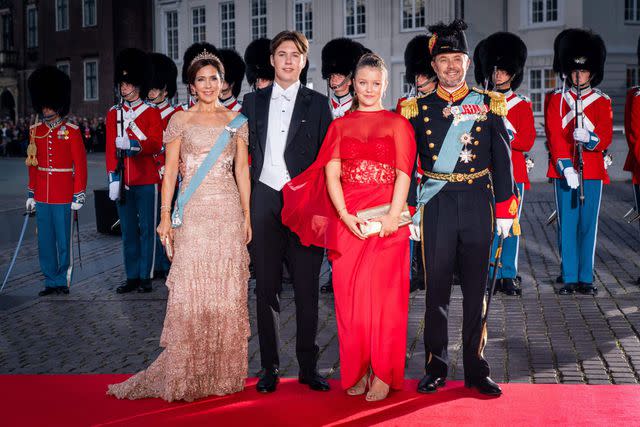 IDA MARIE ODGAARD/Ritzau Scanpix/AFP via Getty Crown Prince Frederik and Crown Princess Mary of Denmark with Prince Christian and Princess Isabella of Denmark arrive at the Danish Royal Theatre in Copenhagen to attend the 50th anniversary of Queen Margrethe's accession