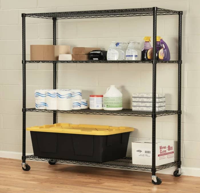 a wheeled shelf with items on it