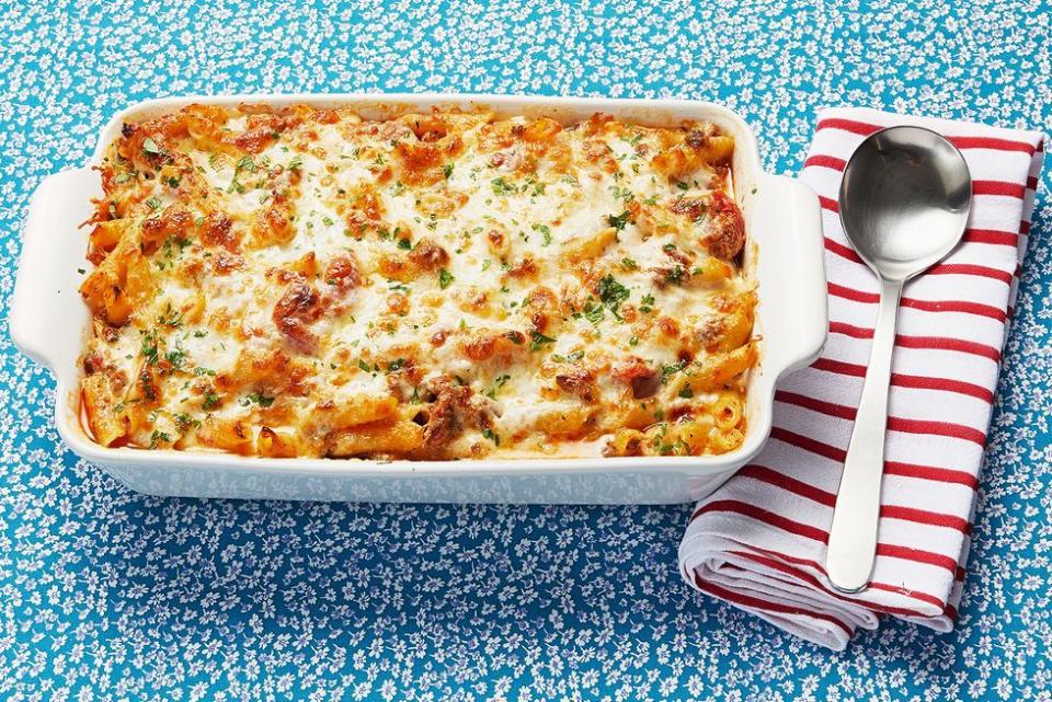 baked ziti blue background with red and white stripes