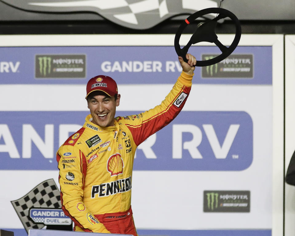 Joey Logano celebrates in Victory Lane after winning the second of two qualifying auto races for the NASCAR Daytona 500 at Daytona International Speedway, Thursday, Feb. 14, 2019, in Daytona Beach, Fla. (AP Photo/John Raoux)