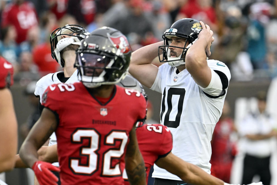 Jacksonville Jaguars place kicker Brandon McManus, right, reacts after missing a field goal during the first half of an NFL football game against the Tampa Bay Buccaneers Sunday, Dec. 24, 2023, in Tampa, Fla. (AP Photo/Jason Behnken)