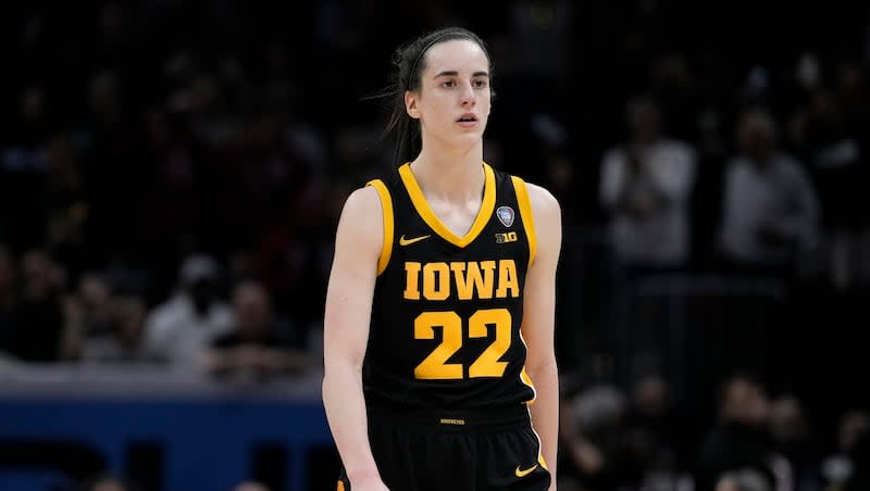 Iowa guard Caitlin Clark walks to the bench during the championship game against South Carolina in the women's NCAA Tournament, Sunday, April 7, 2024, in Cleveland. South Carolina won 87-75.