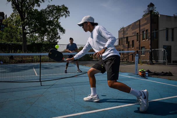 PHOTO: People play pickleball at a public court in Brooklyn, New York, on Sept. 16, 2022. (Ed Jones/AFP via Getty Images, FILE)