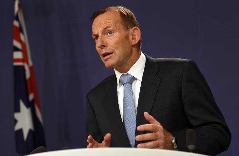 Australian Prime Minister Tony Abbott's government on Wednesday introduced new laws into to parliament to strip dual nationals linked to terrorism of their citizenship