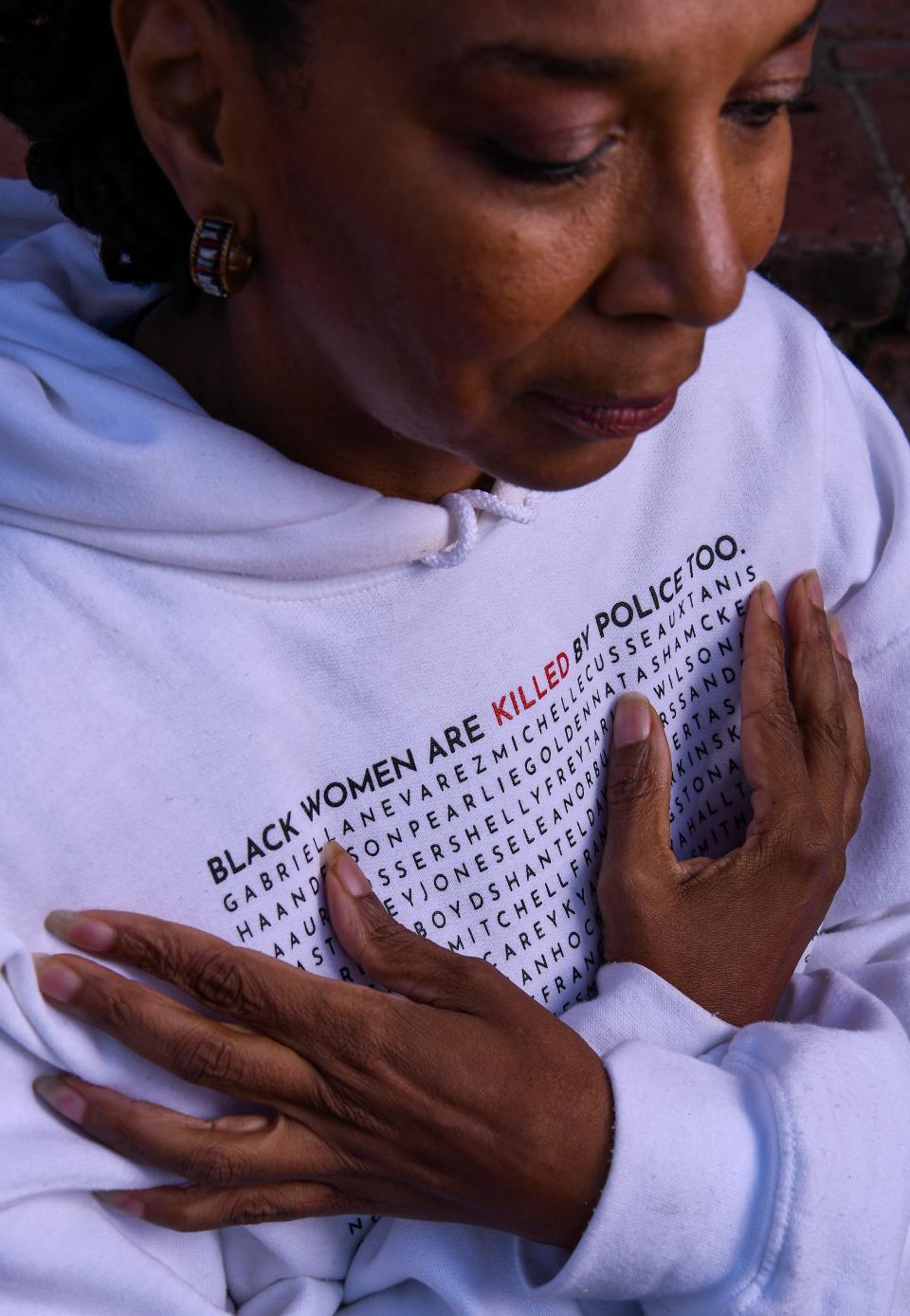 Kimberlé Crenshaw, Co-Founder and Executive Director of the African American Policy Forum wears a hoodie with the names of Black daughters, sisters, wives, cousins, and community members killed by police.