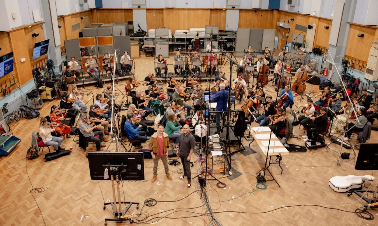 <span>Matthew Bellamy and Ilan Eshkeri with the orchestra at Abbey Road Studios</span><span>Photograph: Gantcho Beltchev/PR IMAGE</span>