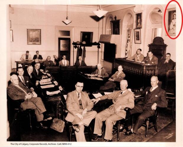 The portrait of the Queen is seen hanging above Mayor Don MacKay's chair in the early 1950s. 