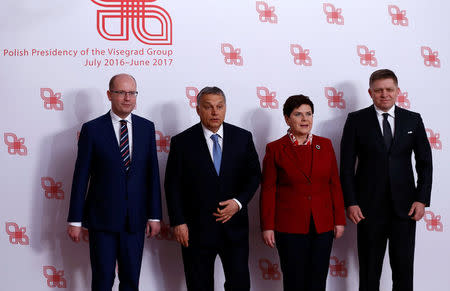 Visegrad Group (V4) member nations' Prime Ministers, Bohuslav Sobotka of the Czech Republic, Hungary's Viktor Orban, Poland's Beata Szydlo and Slovakia's Robert Fico pose for a family photo during a summit in Warsaw, Poland March 2, 2017. REUTERS/Kacper Pempel