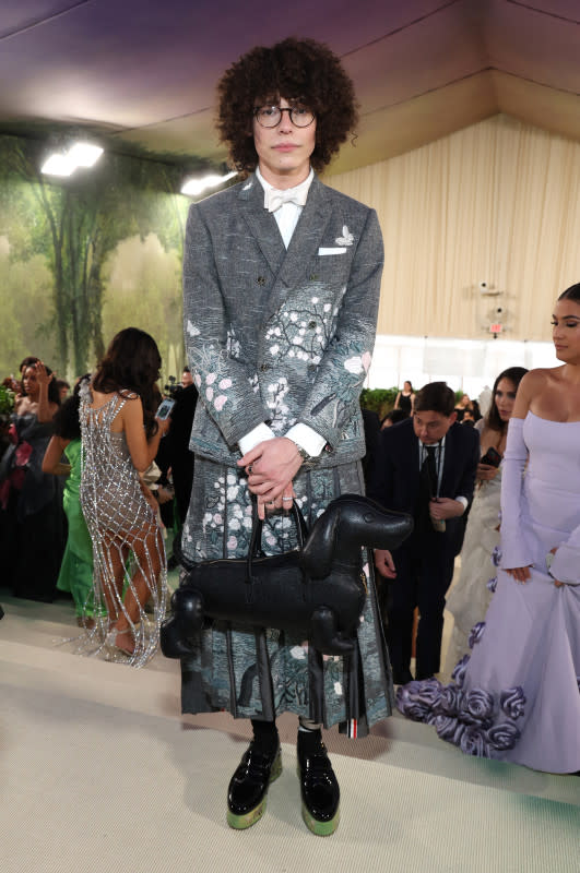 <p>Kevin Mazur/MG24/Getty Images</p><p>The TikTok star wore a floral skirt suit and carried one of Thom Browne's signature Hector bags in the shape of a dog. </p>