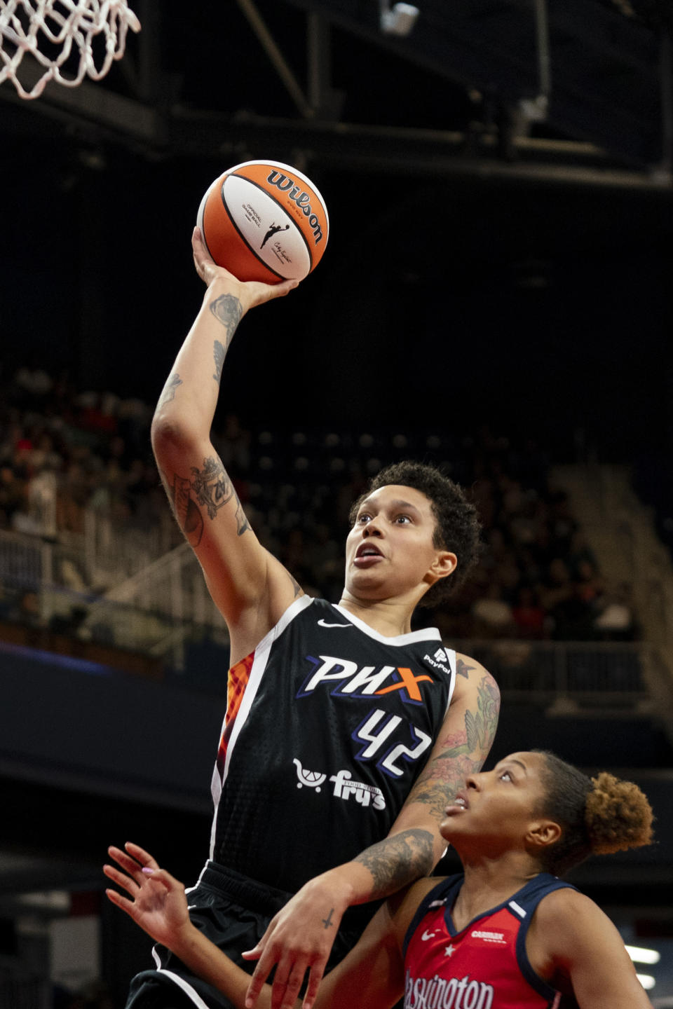 FILE - Phoenix Mercury center Brittney Griner (42) makes a layup during the second quarter of a WNBA basketball game against the Washington Mystics, Sunday, July 23, 2023, in Washington. A’ja Wilson, Breanna Stewart and Brittney Griner will be back on the courts chasing another WNBA title when camps open on Sunday, April 28. (AP Photo/Stephanie Scarbrough, File)