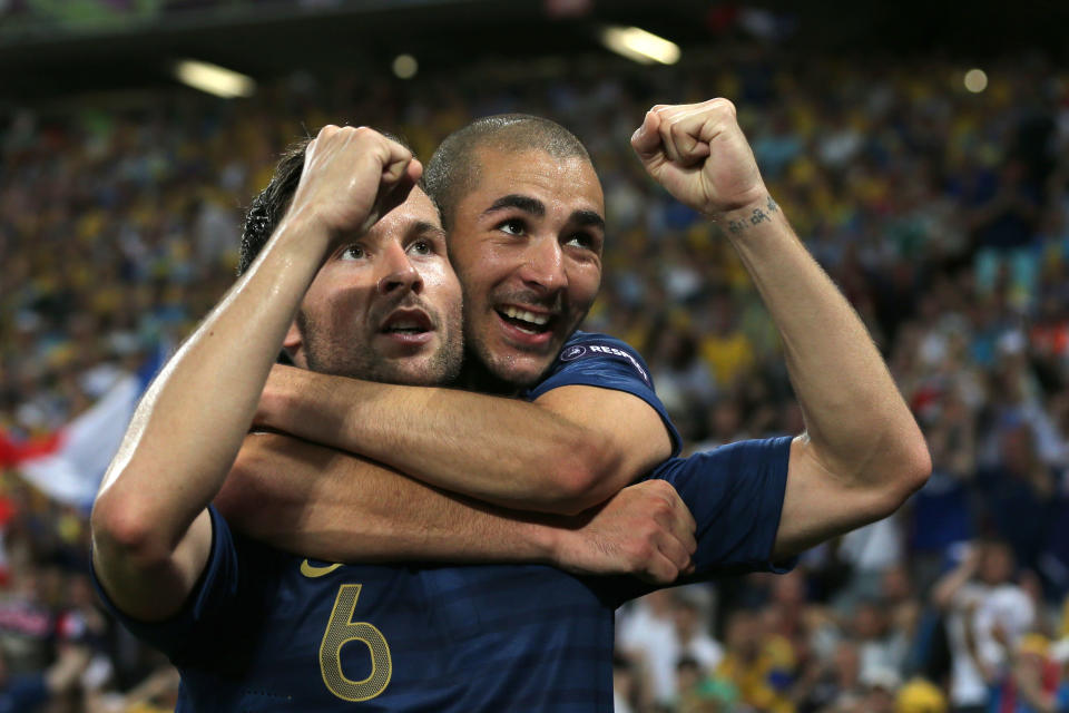 DONETSK, UKRAINE - JUNE 15: Yohan Cabaye of France celebrates scoring their second goal with Karim Benzema of France during the UEFA EURO 2012 group D match between Ukraine and France at Donbass Arena on June 15, 2012 in Donetsk, Ukraine. (Photo by Ian Walton/Getty Images)