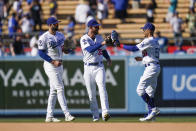 From left to right, Los Angeles Dodgers' Joey Gallo, Cody Bellinger and Mookie Betts celebrate a win in a baseball game against the St. Louis Cardinals, Sunday, Sept. 25, 2022, in Los Angeles. (AP Photo/Jae C. Hong)