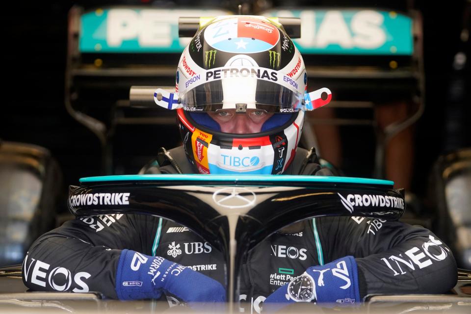 Mercedes driver Valtteri Bottas, of Finland, climbs into his car during a practice session for the Formula One U.S. Grand Prix auto race at the Circuit of the Americas