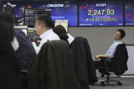 A currency trader works at the foreign exchange dealing room of the KEB Hana Bank headquarters in Seoul, South Korea, Thursday, Jan. 23, 2020. Asian shares are mostly higher as health authorities around the world move to monitor and contain a deadly virus outbreak in China and keep it from spreading globally. (AP Photo/Ahn Young-joon)