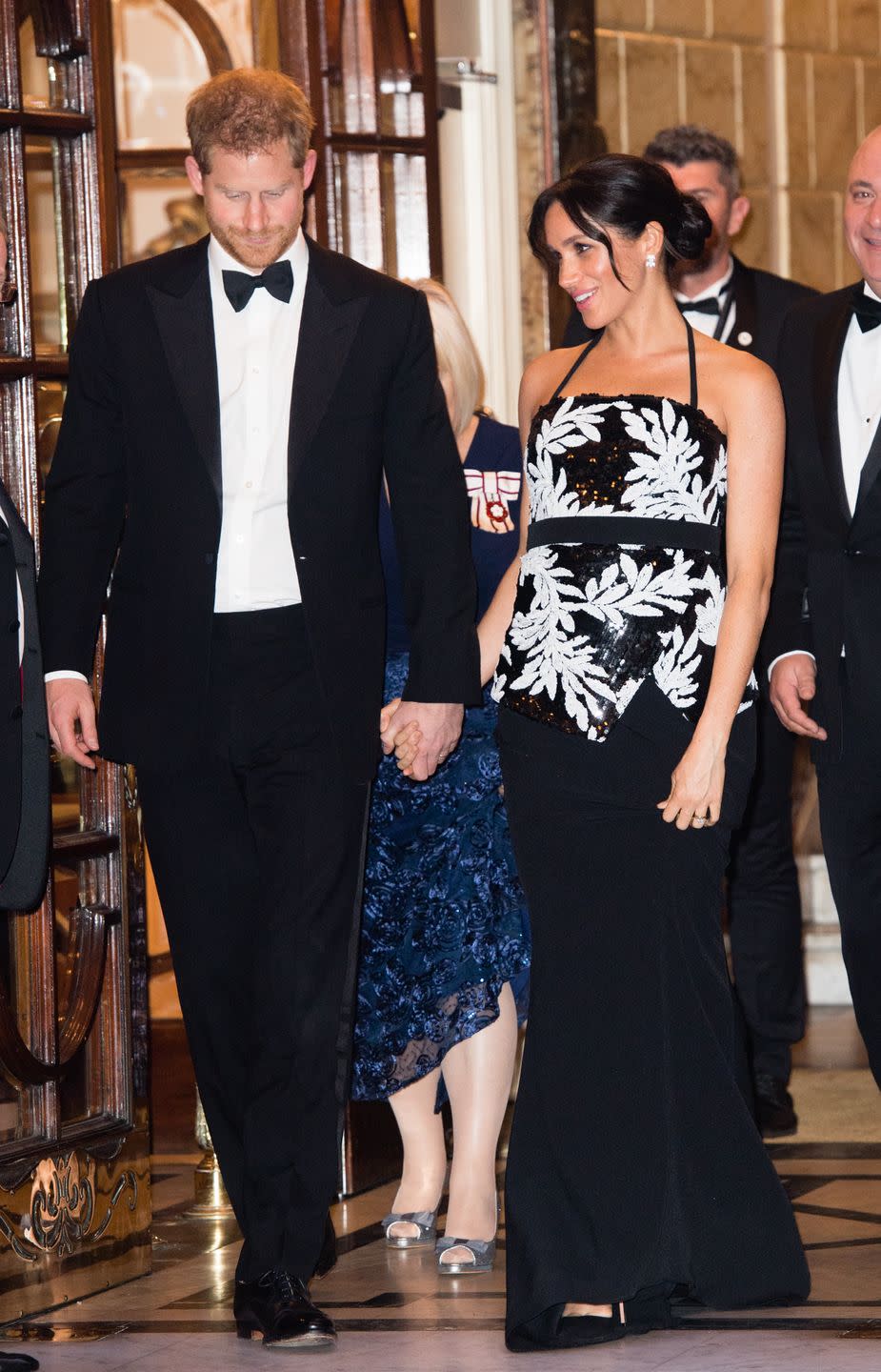 The Duke and Duchess of Sussex hold hands as they arrive at the Royal Variety Performance.