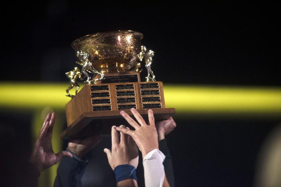 Council Rock North football players raise the Council Rock bowl after winning against CR South at Walt Snyder Stadium at Council Rock North on Friday, Oct. 30. The Indians defeated the Golden Hawks 7-3.